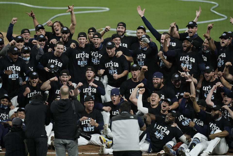 The Tampa Bay Rays celebrate after defeating the New York Yankees 2-1 in Game 5 of a baseball AL Division Series, Friday, Oct. 9, 2020, in San Diego. (AP Photo/Jae C. Hong)