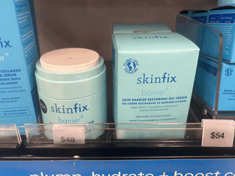 Blue Skinfix products on display at Sephira. Light-blue boxes of the Skinfix barrier+ skin barrier restoring gel cream sit next to containers of the cream