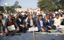 Retired college teachers participate in a protest against the Citizenship Amendment Act in Gauhati, India, Friday, Dec. 27, 2019. Tens of thousands of protesters have taken to India's streets to call for the revocation of the law, which critics say is the latest effort by Narendra Modi's government to marginalize the country's 200 million Muslims. (AP Photo/Anupam Nath)