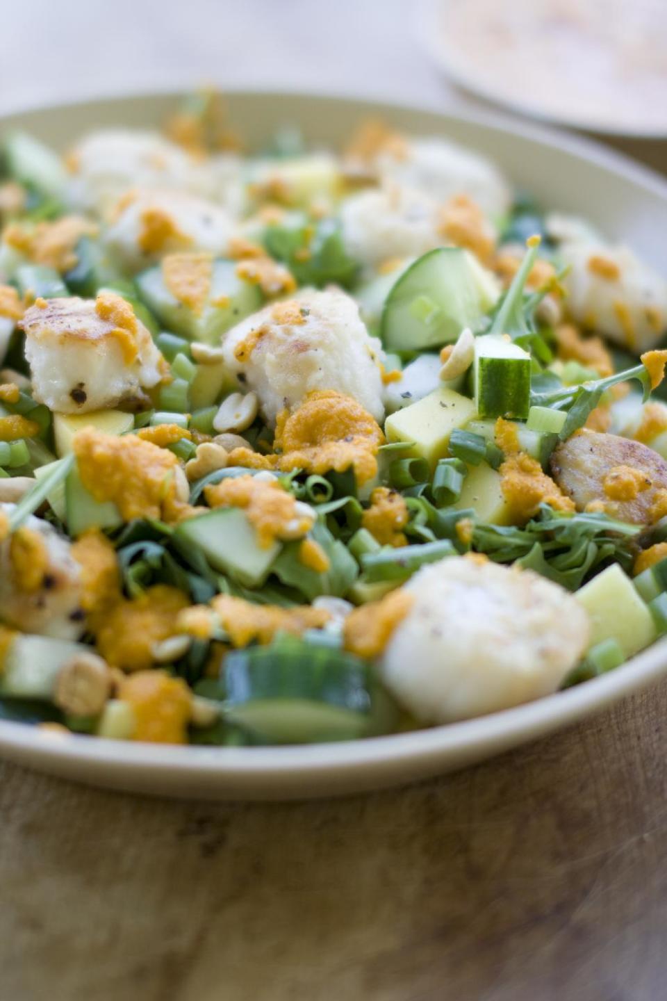 This July 15, 2013 photo shows a warm scallop salad with carrot-ginger dressing in Concord, N.H. (AP Photo/Mathew Mead)