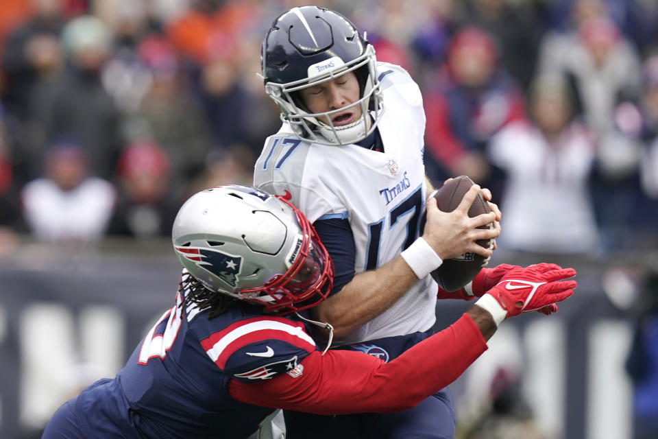 FILE - Tennessee Titans quarterback Ryan Tannehill (17) is sacked by New England Patriots outside linebacker Matt Judon, left, during the first half of an NFL football game Nov. 28, 2021, in Foxborough, Mass. Judon won over his Patriots teammates and fanbase last season with his outsized personality and ability to cause disruption for opposing quarterbacks. (AP Photo/Steven Senne, File)