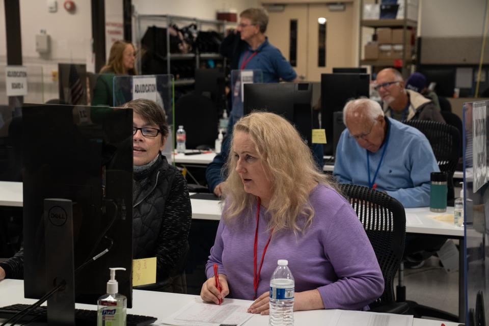 Adjudicators process ballots on Nov. 11, 2022, at the Maricopa County Tabulation and Elections Center in Phoenix.