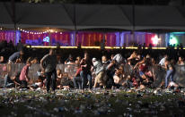 <p>People run from the Route 91 Harvest country music festival after apparent gun fire was heard on Oct. , 2017 in Las Vegas, Nevada. (Photo: David Becker/Getty Images) </p>