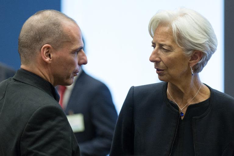 Greek Finance Minister Yanis Varoufakis speaks to International Monetary Fund (IMF) Managing Director Christine Lagarde prior to a eurozone finance ministers' meeting in Luxembourg, on June 18, 2015