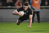 New Zealand's Will Jordan is airborne as he scores a try during the Bledisloe Cup rugby test match between the All Blacks and the Wallabies at Eden Park in Auckland, New Zealand, Saturday, Sept. 24, 2022. (Andrew Cornaga/Photosport via AP)