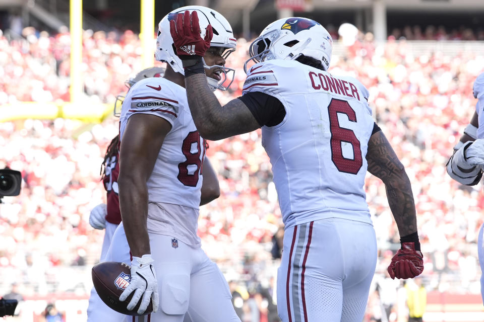 Arizona Cardinals tight end Elijah Higgins, left, is congratulated by running back James Conner (6) after scoring against the San Francisco 49ers during the second half of an NFL football game in Santa Clara, Calif., Sunday, Oct. 6, 2024. (AP Photo/Godofredo A. Vásquez)