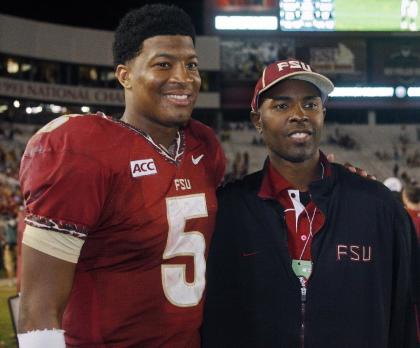 Jameis Winston and Charlie Ward pose for a photo after a 2013 game. (AP)