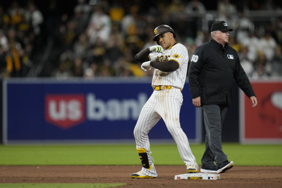 San Diego Padres' Juan Soto dances on second base after hitting a double during the sixth inning of a baseball game against the Cincinnati Reds, Tuesday, May 2, 2023, in San Diego. (AP Photo/Gregory Bull)