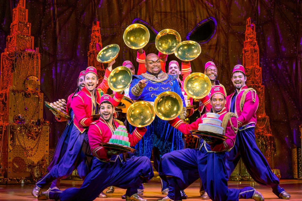 Marcus M. Martin, center, as the Genie in the national tour of Disney's 'Aladdin," to appear March 15-19 at The Hanover Theatre.