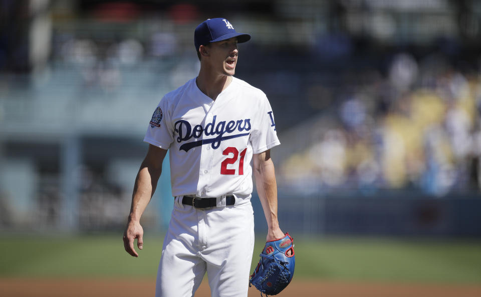 Los Angeles Dodgers starting pitcher Walker Buehler shouts as he leaves the mound after the first inning of a tiebreaker baseball game against the Colorado Rockies, Monday, Oct. 1, 2018, in Los Angeles. (AP Photo/Jae C. Hong)