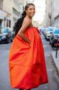 Gabrielle Union is seen rocking an orange, strapless Christopher John Rogers dress during Paris Fashion Week on Saturday.