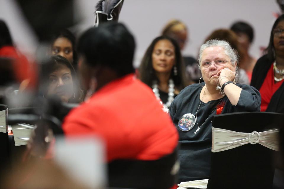 Ann Cadaret cries during a performance by Sharon Spence at a Mother's Day Gala, hosted by the Mothers Against Murderers Association, on May 11, 2024. Cadaret attended the gala with Robbin Jackman, whose son Romen Phelps was killed by an off-duty police officer.