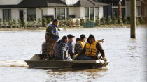 <p>Community members use a small boat to help in a cattle rescue operation after rainstorms caused flooding and landslides in Abbotsford, British Columbia, Canada November 16, 2021. REUTERS/Jesse Winter</p> 