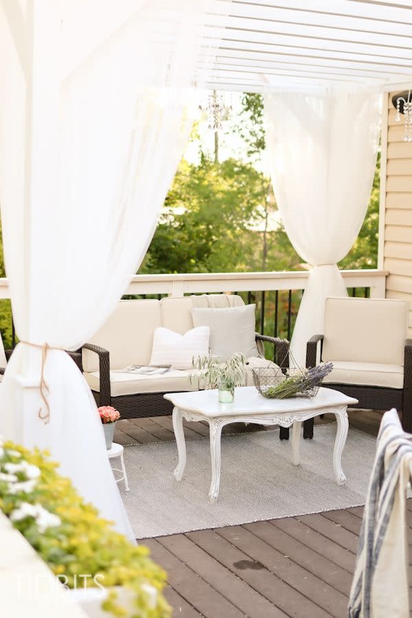 curtains over a covered porch