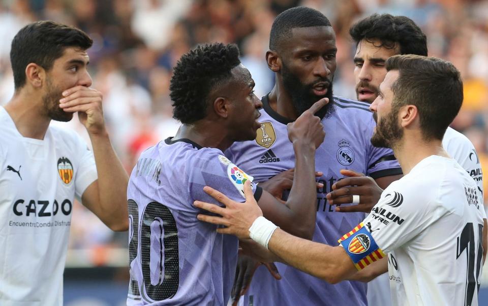 Real Madrid's Vinicius Junior points to someone in the crowd during a Spanish La Liga soccer match between Valencia and Real Madrid, at the Mestalla stadium in Valencia - Vinicius Junior accuses Spain of being a racist country after further abuse - AP/Alberto Saiz