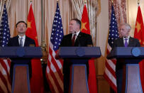 U.S. Secretary of State Mike Pompeo and Defense Secretary James Mattis listen to Chinese Communist Party Office of Foreign Affairs Director Yang Jiechi speak as they hold a joint media news conference after participating in a second diplomatic and security meeting at the U.S. Department of State, Washington, U.S., November 9, 2018. REUTERS/Leah Millis