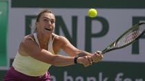 Aryna Sabalenka, of Belarus, returns a shot to Coco Gauff, of the United States, at the BNP Paribas Open tennis tournament Wednesday, March 15, 2023, in Indian Wells, Calif. (AP Photo/Mark J. Terrill)