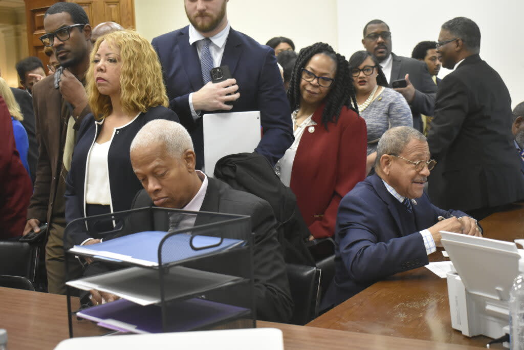 Georgia Democratic Congressmen Hank Johnson and Sanford Bishop fill out qualifying paperwork, while candidates including Congresswomen Lucy McBath and Nikema Williams wait in line behind them. Ross Williams/Georgia Recorder