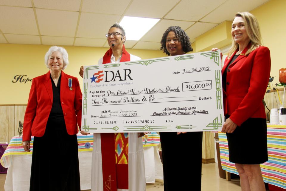 Pitts Chapel United Methodist Church received a $10,000 historic preservation grant from the National Society of the Daughters of the American Revolution. From left, Pat Haas, a member of the Rachel Donelson Chapter, Pitts Chapel Rev. Tracey Wolff, Pitts chair Charlotte Hardin and Pamela Anderson, also a member of the Rachel Donelson chapter, pose with the grant check.