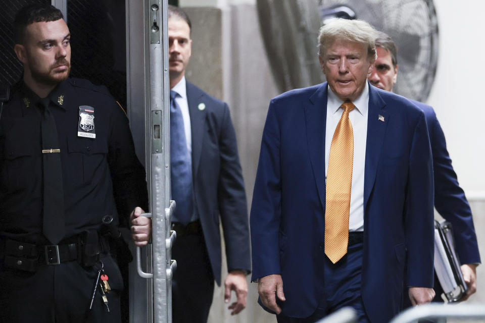 Former President Donald Trump walks to speak to reporters at Manhattan Criminal Court on May 7, 2024 in New York. (Win McNamee/Pool Photo via AP)
