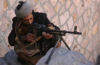 A fighter with the Popular Resistance Committees -- loyal to Yemen's fugitive leader Abedrabbo Mansour Hadi -- keeps position in the city of Taez during clashes with Shiite Huthi rebels, on May 3, 2015