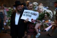 People gather to attend a vigil outside Finsbury Park Mosque, close to the scene of a van attack in Finsbury Park, north London on June 19, 2017