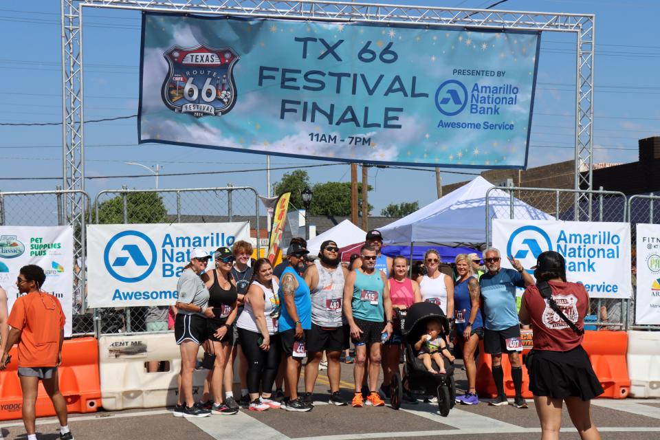 Participants get a group photo before the Fitness @ KT Black 5K/1K Run/Walk on Saturday morning. The Texas Route 66 Festival event raised funds for the Hope Lives Here organization.