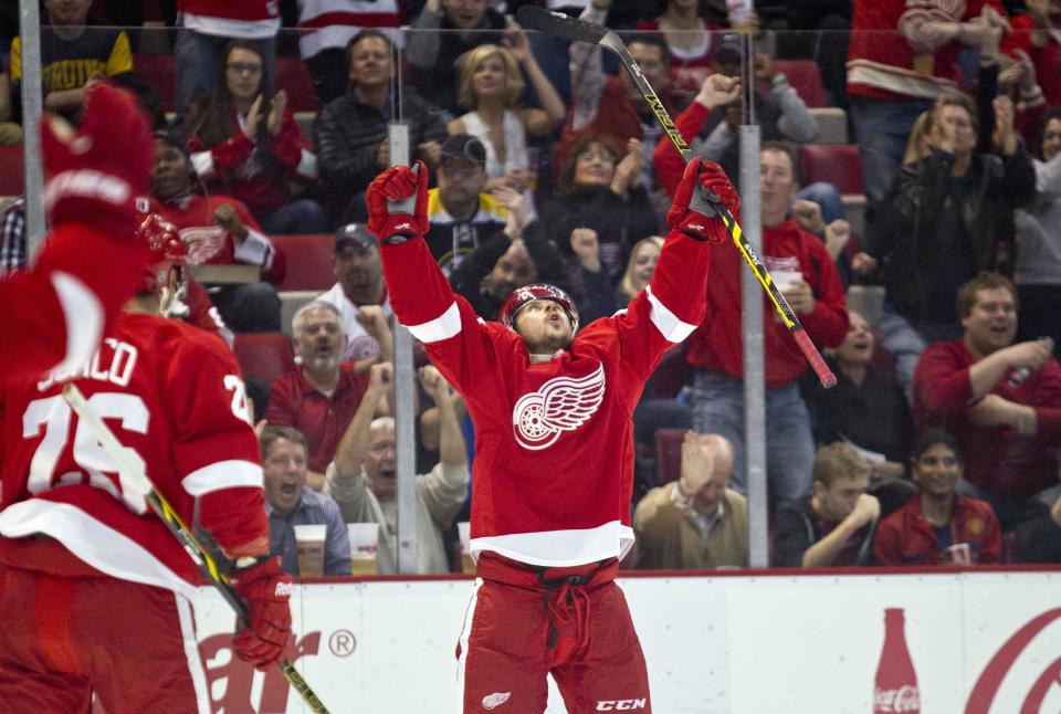 Detroit Red Wings forward Tomas Tatar celebrates his goal during the second period of an NHL hockey game against the Boston Bruins in Detroit, Mich., Wednesday, April 2, 2014. (AP Photo/Tony Ding)