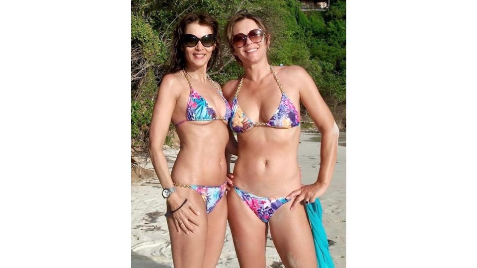 A photo of Elizabeth Hurley and her friend Cecilia wearing tropical print bikinis