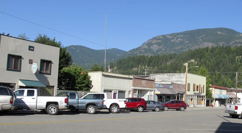 This Wednesday, July 31, 2019 photo shows downtown Metaline Falls, Wash., a mixture of shuttered and open businesses. The tiny town suffered a big blow when the nearby Pend Oreille Mine closed at a cost of some 200 good-paying jobs. (AP Photo/Nicholas K. Geranios)