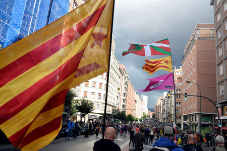 FILE PHOTO: Protesters carry Catalan and Basque flags during a march organised by pro-Basque independence organization Gure Esku Dago (In Our Hands) in favour of a planned referendum on the independence of Catalonia, in Bilbao, Spain, September 16, 2017. REUTERS/Vincent West/File Photo