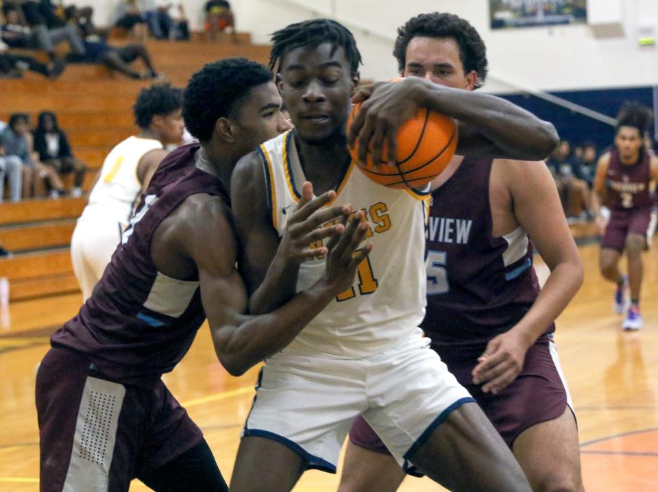 Winter Haven senior Dylan James pulls down a rebound against Sarasota Rivervew on Thurday night in the Class 7A, Region 3 quarterfinals at the Jack Deedrick Gymnasium.