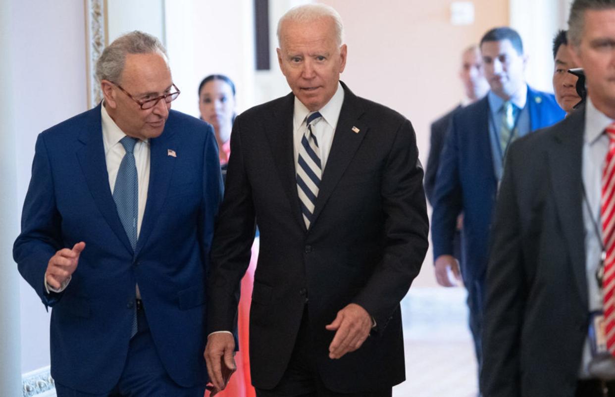 Senate Majority Leader Chuck Schumer, D-N.Y. (left) and President Joe Biden (right)