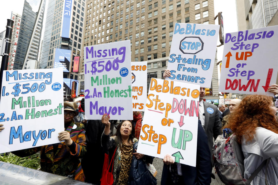 Protestors demonstrate outside "Good Morning America" as New York Mayor Bill de Blasio and his wife Chirlane McCray appear on the show, in New York, Thursday, May 16, 2019. De Blasio announced Thursday that he will seek the Democratic nomination for president, adding his name to an already long list of candidates itching for a chance to take on Donald Trump. (AP Photo/Richard Drew)