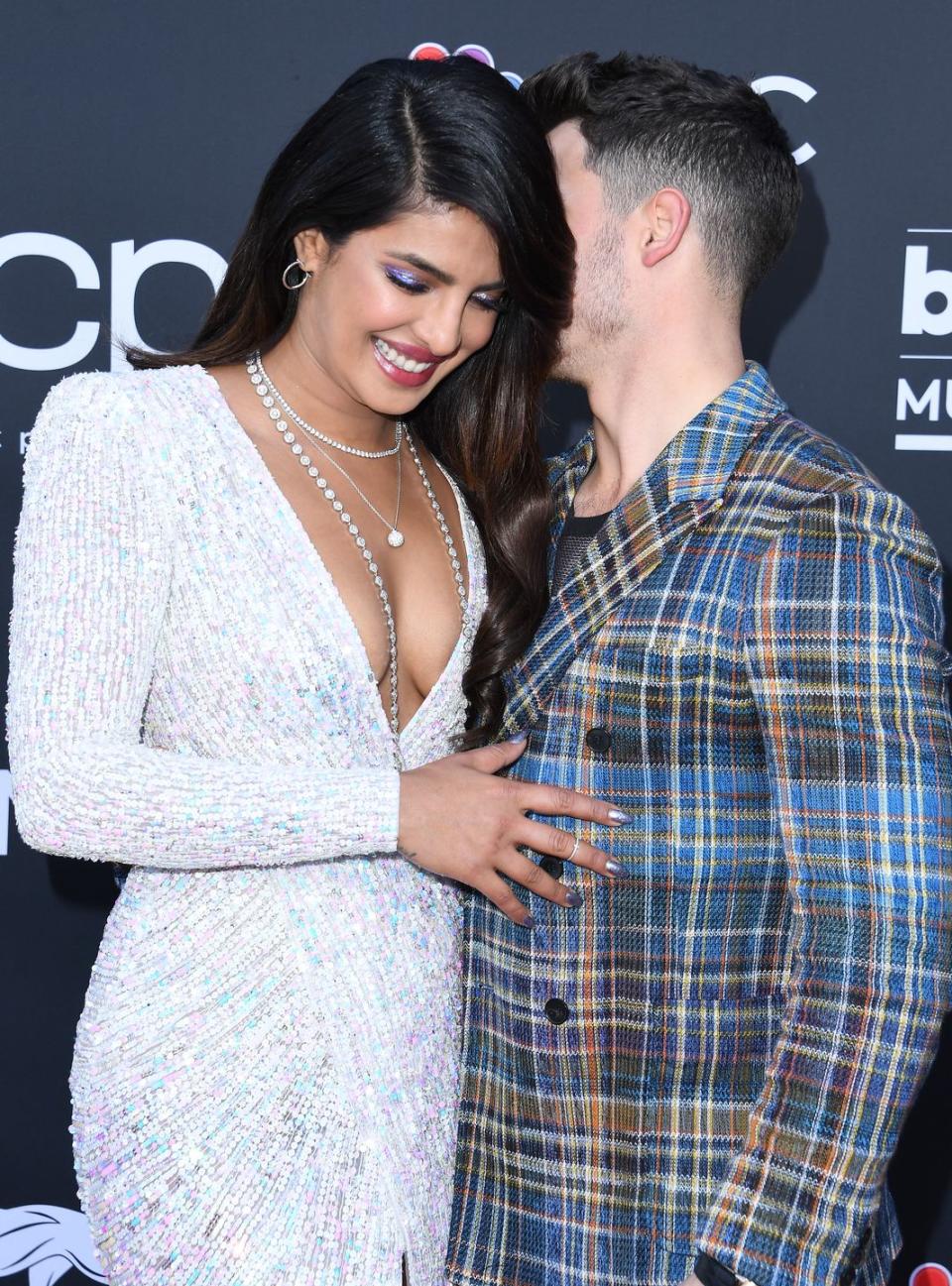 <p>All smiles and whispers at the Vegas ceremony - the couple later <a href="https://www.elle.com/uk/life-and-culture/a27340295/priyanka-chopra-nick-jonas-kiss-jonas-brothers-billboard-music-awards-performance/" rel="nofollow noopener" target="_blank" data-ylk="slk:kiss mid-song;elm:context_link;itc:0;sec:content-canvas" class="link ">kiss mid-song</a> when the Jonas Brothers perform.</p>