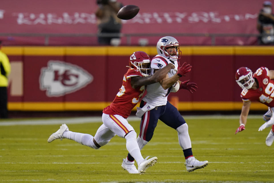 Kansas City Chiefs cornerback Charvarius Ward, left, breaks up a pass intended for New England Patriots wide receiver Julian Edelman during the first half of an NFL football game, Monday, Oct. 5, 2020, in Kansas City. (AP Photo/Jeff Roberson)