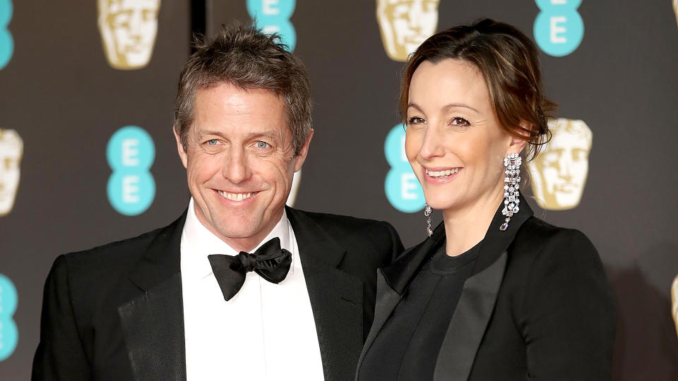 Hugh Grant and Anna Eberstein on the red carpet at the British Academy Film Awards, Feb. 18. (Photo: Mike Marsland/Mike Marsland/WireImage)