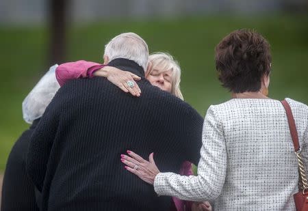The family of Veronica Moser embrace before entering the Arapahoe County District Court in Centennial, Colorado April 27, 2015. REUTERS/Evan Semon