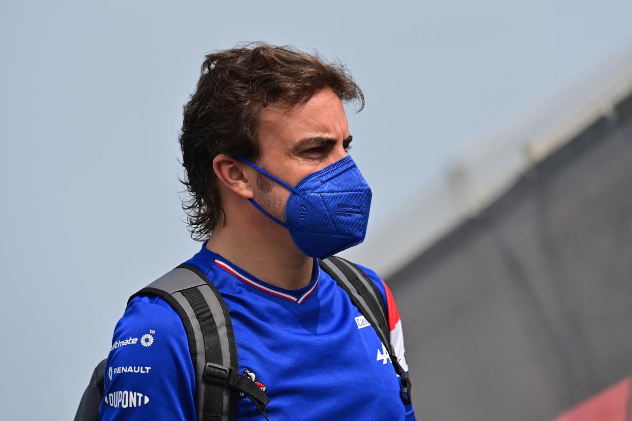 Alpine's Spanish driver Fernando Alonso arrives ahead of the third practice session ahead of the Qatari Formula One Grand Prix at the Losail International Circuit, on the outskirts of the capital city of Doha, on November 20, 2021. (Photo by ANDREJ ISAKOVIC / AFP) (Photo by ANDREJ ISAKOVIC/AFP via Getty Images)