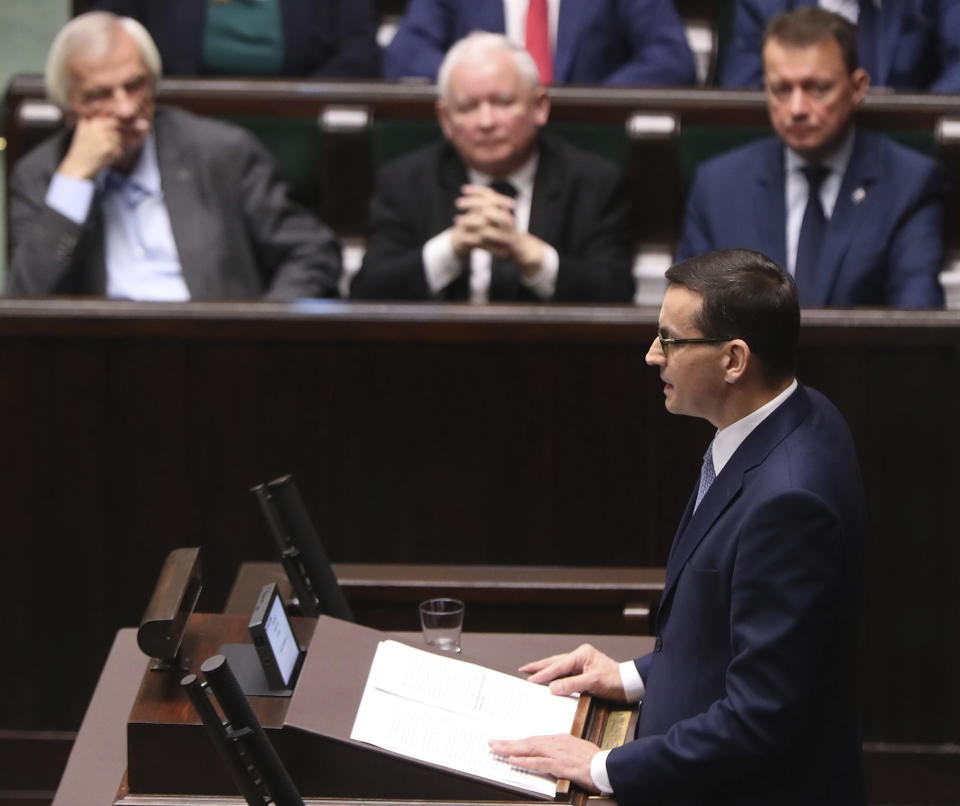 Poland's Prime Minister Mateusz Morawiecki vows to protect U.S. – EU ties and the crucial role of NATO, against criticism from some other European leaders, during his policy speech for his second term in office following October parliamentary elections, in Warsaw, Poland, Tuesday, Nov. 19, 2019. (AP Photo/Czarek Sokolowski)