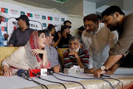 Syeda Shehla Raza (L), nominated candidate of Pakistan Peoples Party (PPP) for the National Assembly seat from Karachi, speaks with party workers during a campaign meeting ahead of general elections in Karachi, Pakistan July 10, 2018. Picture taken July 10, 2018. REUTERS/Akhtar Soomro