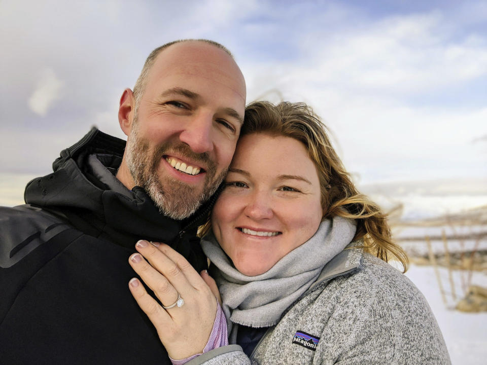 This photo shows Kate Whiting and Jake Avery on Feb. 6, 2020, soon after Avery proposed in Nevada’s Ruby Mountains. The two had been planning a 300-person wedding but decided to marry June 6 in their backyard, with a big party after the coronavirus pandemic settles. They’re feeding a trend toward micro weddings that has grown stronger since the health crisis sent millions into isolation. (Jake Avery via AP Photo)