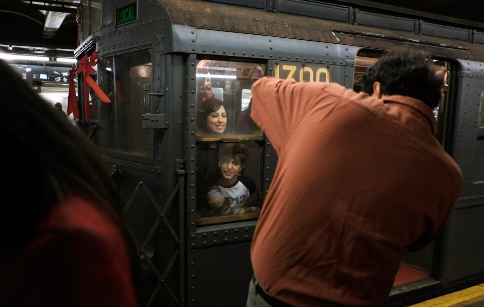 Riders Enjoy Vintage New York City Subway Trains In Annual Holiday Tradition