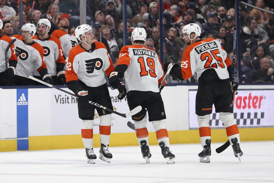 Philadelphia Flyers right wing Olle Lycksell (62) celebrates his goal against the Columbus Blue Jackets with right wing Garnet Hathaway (19) and center Ryan Poehling (25) during the second period of an NHL hockey game Saturday, April 6, 2024, in Columbus, Ohio. (AP Photo/Joe Maiorana)