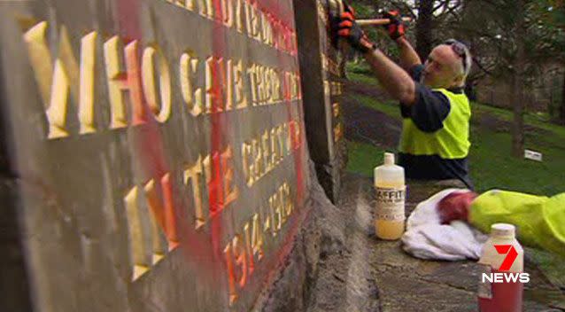 The clean-up is underway to remove graffiti sprayed on the Warrandyte RSL war memorial. Picture: 7 News