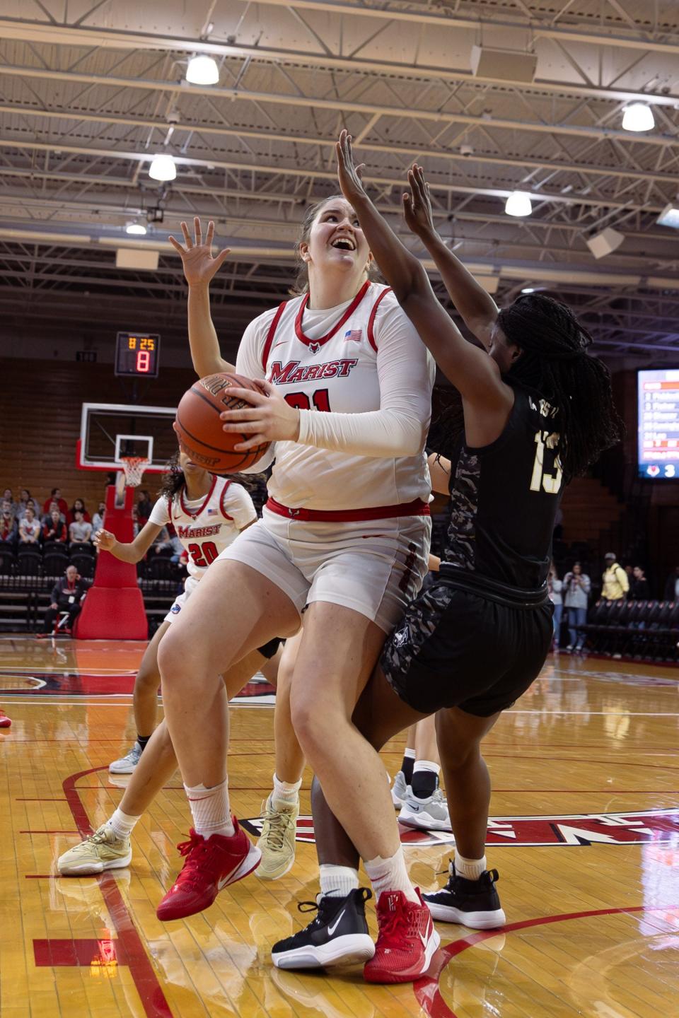 Marist's Morgan Lee posts up and goes for a layup against Army during the Red Foxes women's basketball season opener on Nov. 9, 2023.