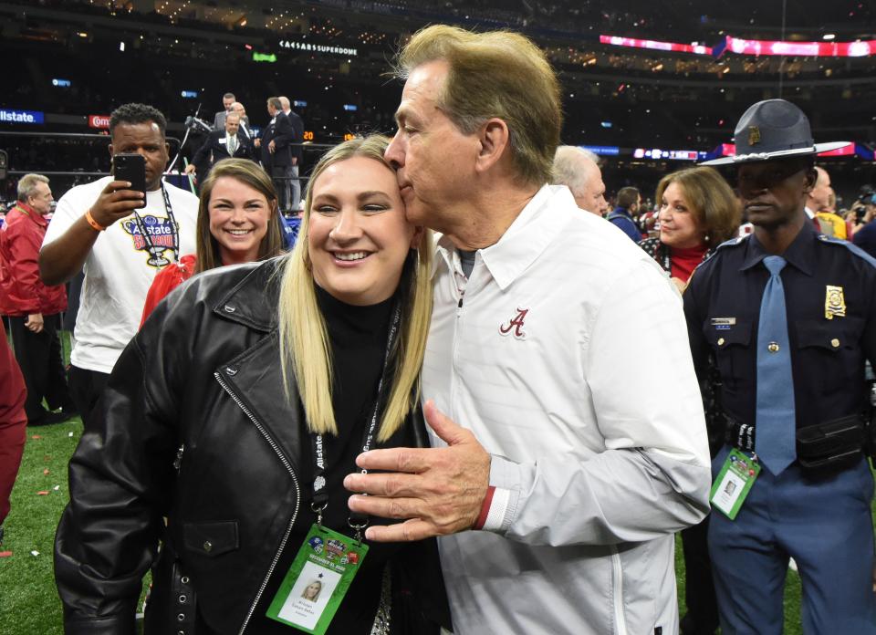 Nick Saban kisses his daughter, Kristen Saban-Setas, after the 2022 Sugar Bowl.