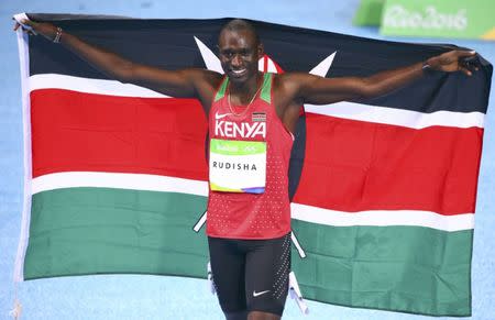 FILE PHOTO: 2016 Rio Olympics - Athletics - Final - Men's 800m Final - Olympic Stadium - Rio de Janeiro, Brazil - 15/08/2016. Gold medallist David Lekuta Rudisha (KEN) of Kenya celebrates with flag. REUTERS/David Gray