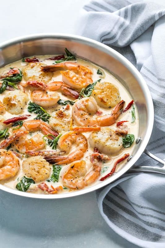 <p>The Blond Cook</p><p>This recipe for Creamy Tuscan Shrimp and Scallops is so quick, easy and sinfully delicious… no one will know you only spent 20 minutes preparing it!</p><p><strong>Get the recipe: <a href="https://theblondcook.com/creamy-tuscan-shrimp-and-scallops/" rel="nofollow noopener" target="_blank" data-ylk="slk:Creamy Tuscan Shrimp and Scallops;elm:context_link;itc:0;sec:content-canvas" class="link ">Creamy Tuscan Shrimp and Scallops</a></strong></p>