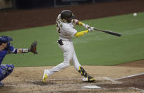 San Diego Padres' Fernando Tatis Jr. hits a two-run home run during the fifth inning of a baseball game against the Los Angeles Dodgers, Wednesday, Aug. 5, 2020, in San Diego. (AP Photo/Gregory Bull)